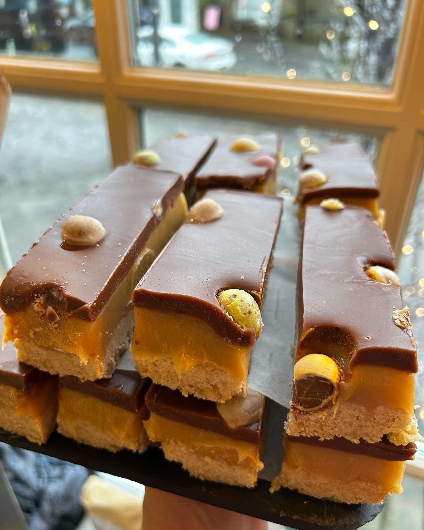 As soon as mini eggs hit the shelves they will pop up in our cake counter! This time we&rsquo;ve added a few to make our classic millionaires shortbread ever better 🤤 available all weekend!