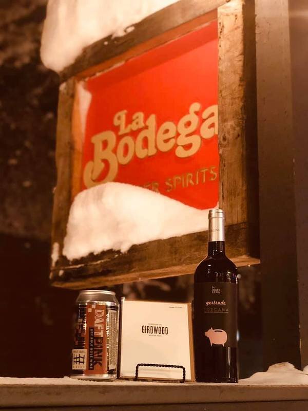  Wine in front of the La Bodega sign 