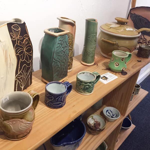  A shelf of pottery for sale at Girdwood Center for Visual Arts  