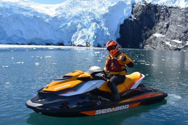  A jet skier from Alaska Wild Guides next to a glacier in Prince William Sound with Alaska Wild Guides 