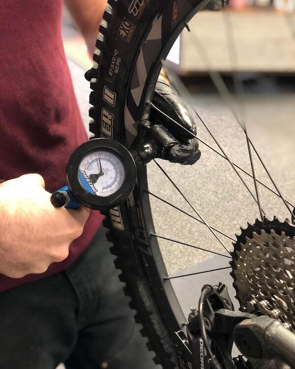  A tire pressure checking a bike tire 