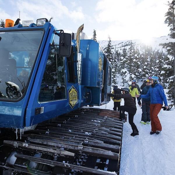  Skiers getting into a snowcat to go up the mountain with Chugach Powder Guide 