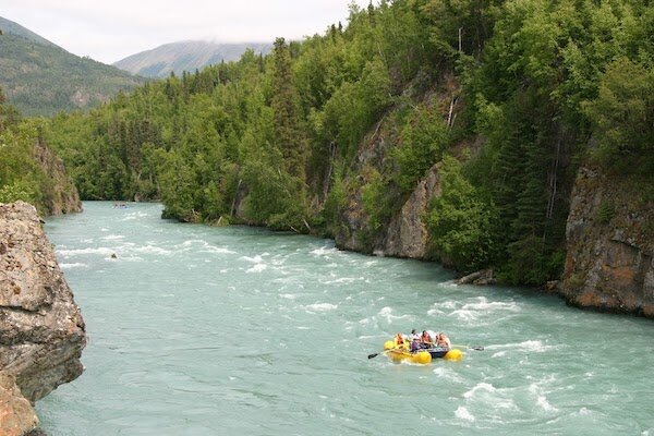  People rafting down Kenai River near Alaska Wildland Lodge 