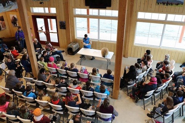  People sitting in classroom in Alaska Wildlife Conservation Center 