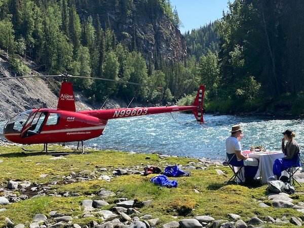 Alpine Air helicopter on shore of lake 