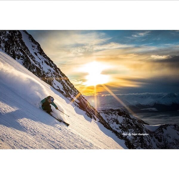  A skier coming down the mountain during sunset and photo by Ralph Krisopher Photography 