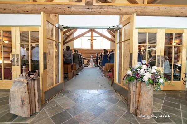  Walking into the chapel area with benches at Chapel of the Lady of the Snows 