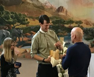  Pastor accept a gift from a church member in Girdwood Chapel 