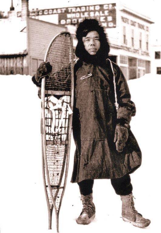  Native Alaskan from 1930s holding snowshoes 