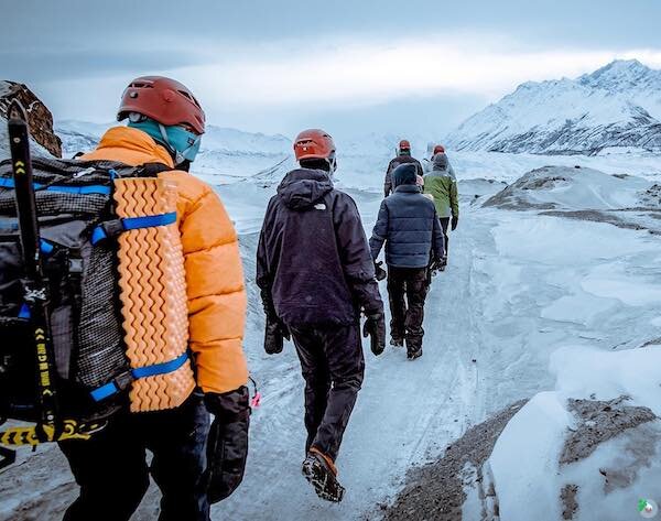  People hiking in the winter with Salmon Berry Tours 