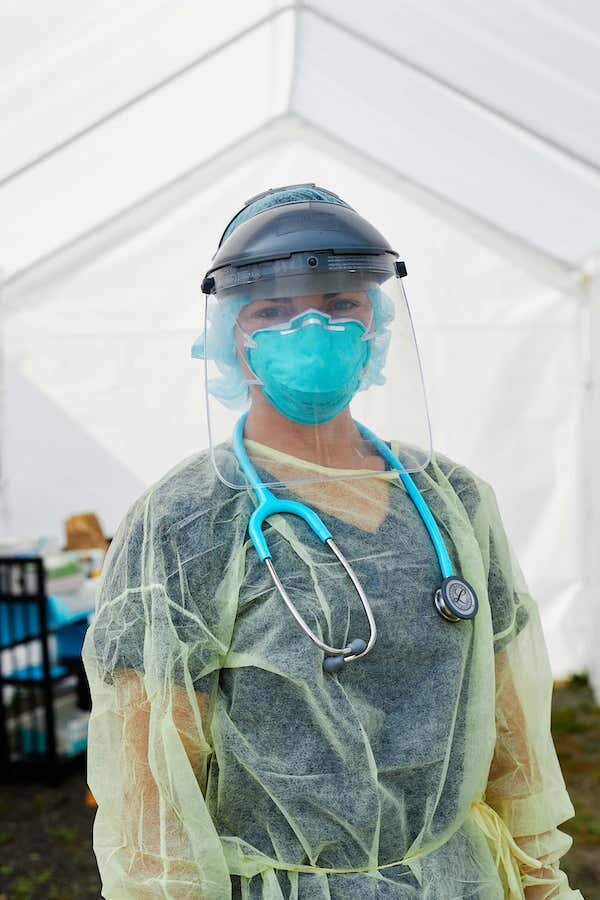  Health Worker in mask and gown at Girdwood Health Clinic  