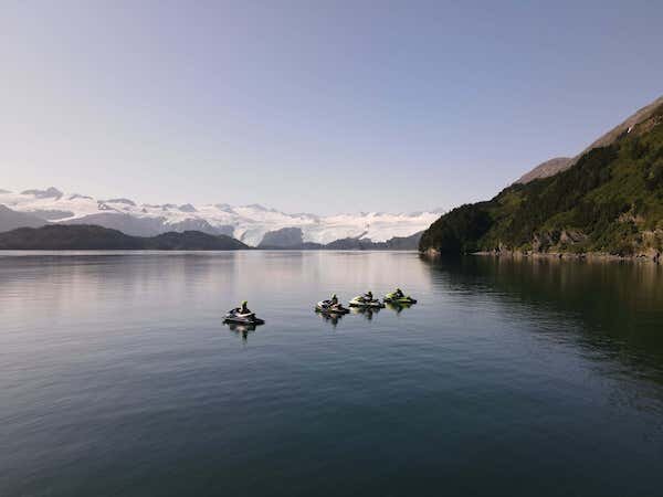  Jet ski riders in calm water on a tour with Glacier Jet Ski Adventures 