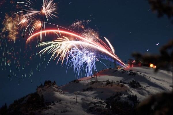  Fireworks being shot off from mid-mountain on Alyeska Resort 