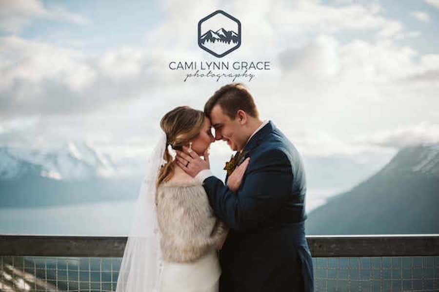  A couple holding each other on a bridge photographed by Cami Lynn Grace Photography 