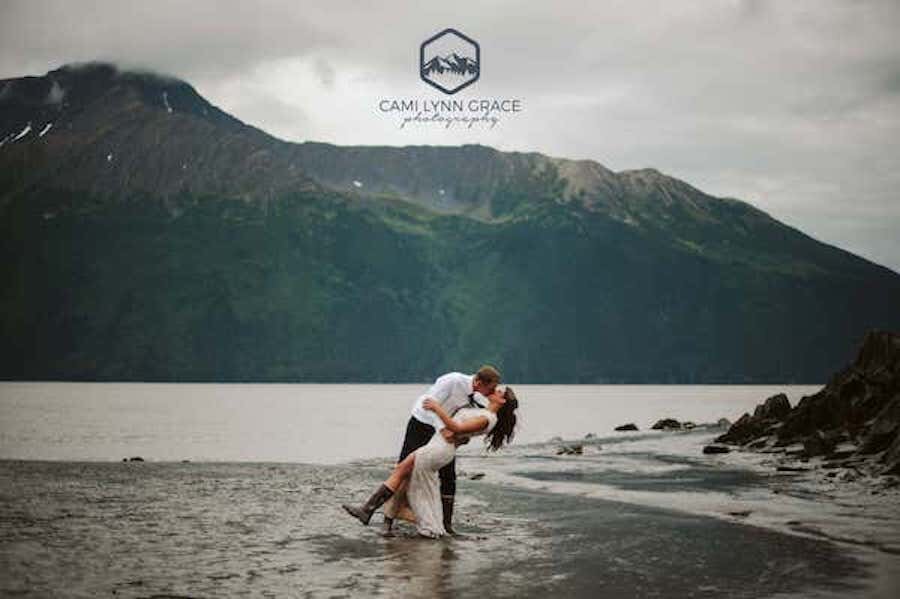  A couple kissing next to the ocean photographed by Cami Lynn Grace Photography 