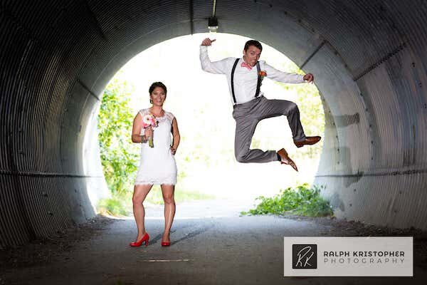  A bride and groom in tunnel jumping  photo by Ralph Krisopher Photography 