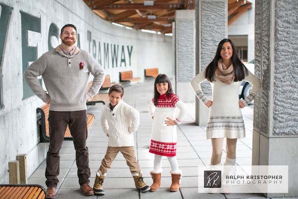  A family photo of four people standing in tramway of Hotel Alyeska  photo by Ralph Krisopher Photography 