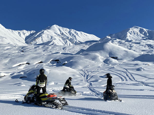  Three Snowmobile riders on a tour with Alaska Wildeguides 