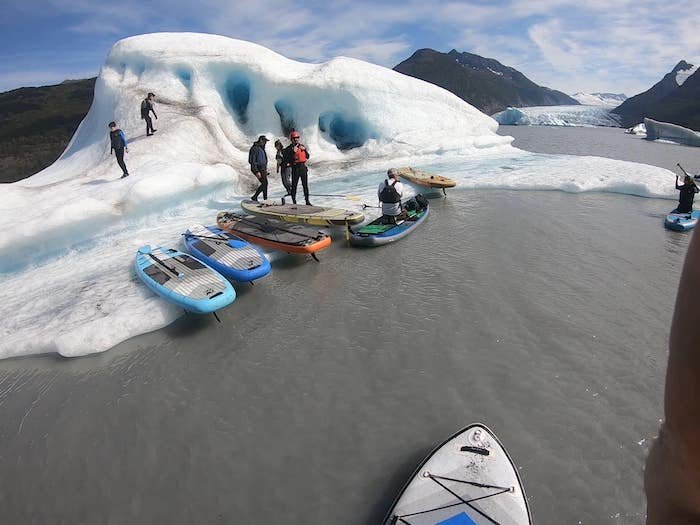  A group checking out a iceberg with Swift Adventures 