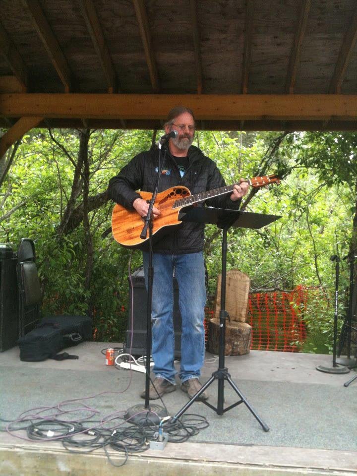  A guitar player on stage at the Girdwood Forest Fair 