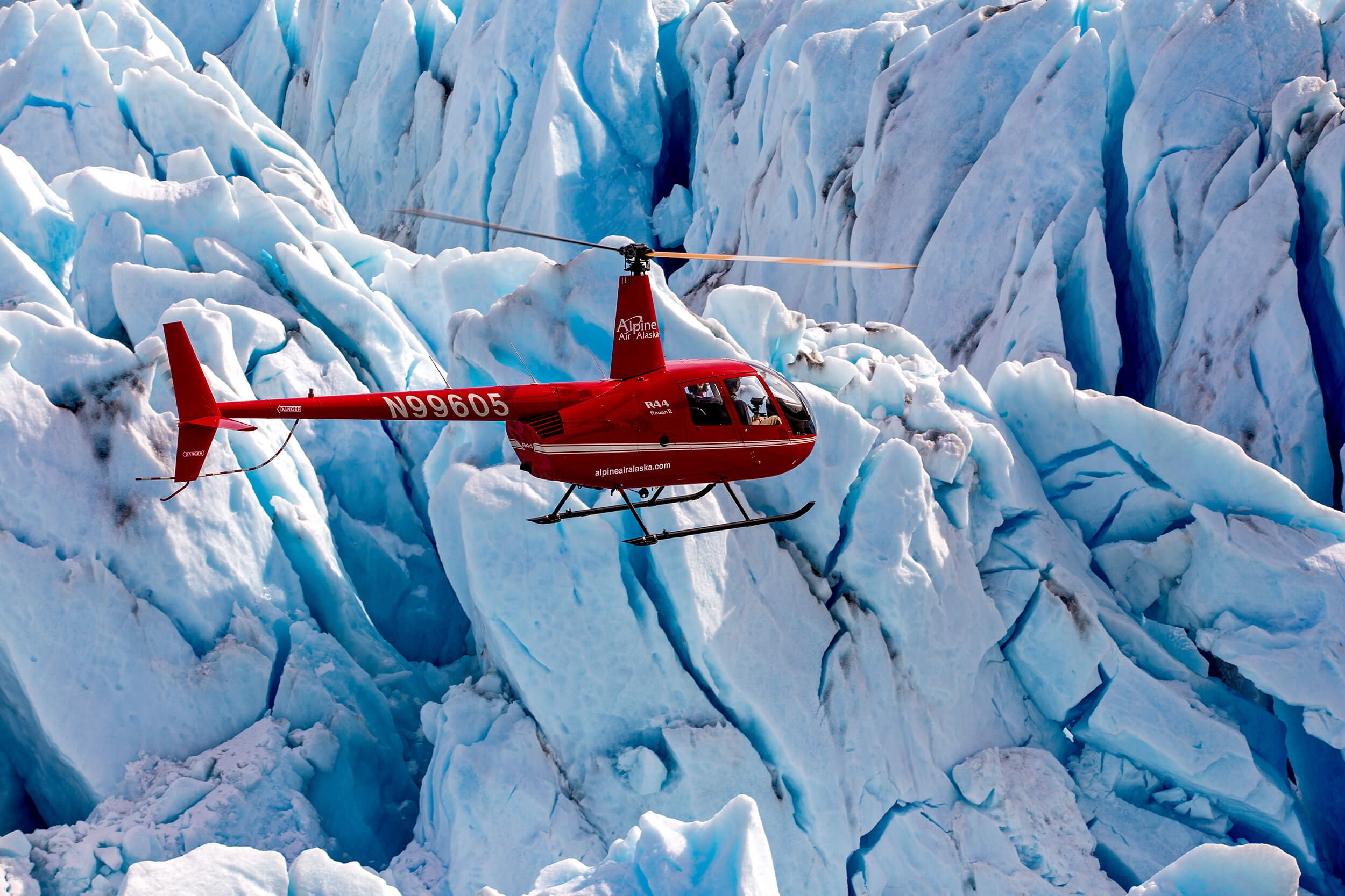  Alpine air helicopter next to a glacier 