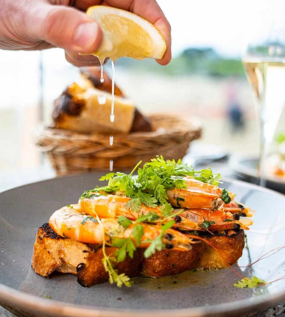 Simplicity done right ✨

Saut&eacute;ed shell-on crevettes in rich garlic butter, finished with fresh parsley and a squeeze of lemon. Served on toasted rosemary &amp; sea salt focaccia to soak up every last drop. 🦐🍋

Available on our lunch and dinn