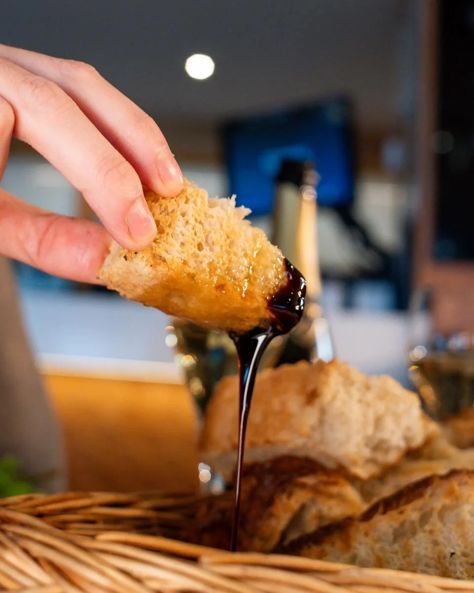 An indulgence in every dip.

Freshly baked rosemary and sea salt focaccia, paired with olive oil and a velvety aged balsamic glaze &mdash; rustic, elegant, and made to be savored.

Join us for a taste of simple luxury. ✨

#gyllybeach #falmouth #fresh