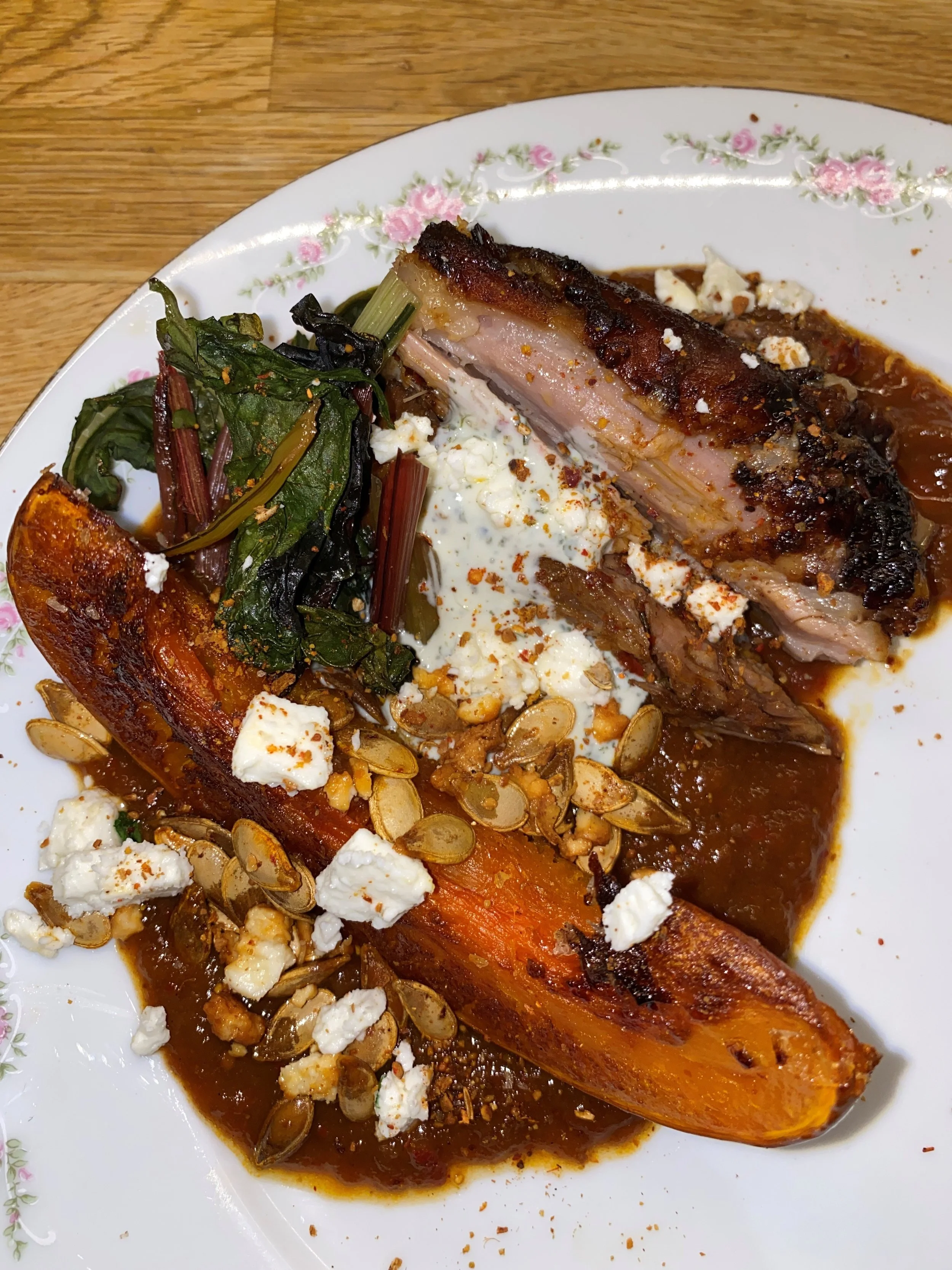 Slow cooked harissa lamb with roasted pumpkin and dhukka