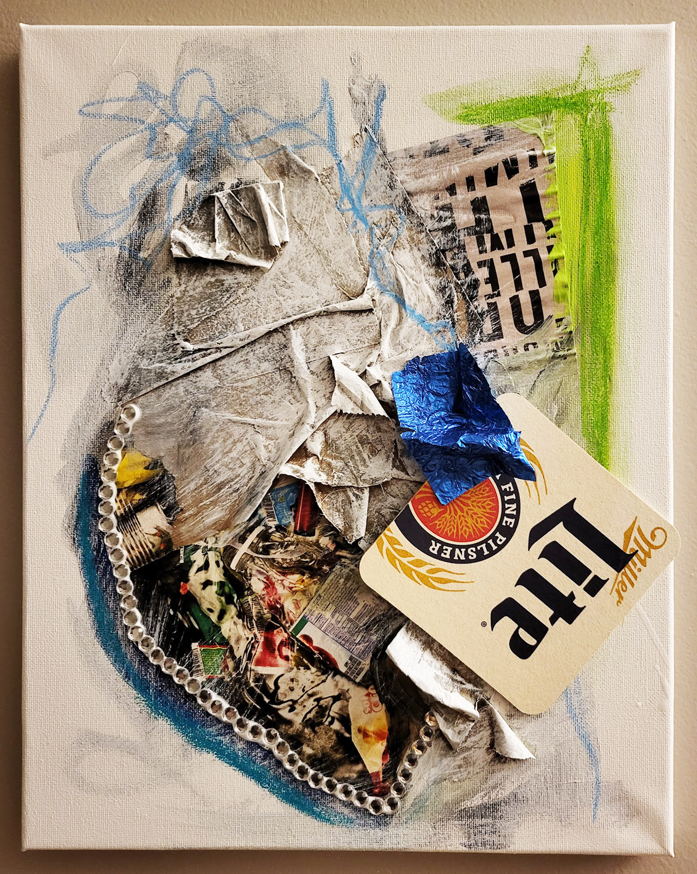 IS IT STILL TRASH? // 11"W x 14"H // Various Trash, Cut Paper, Acrylic, Oil Pastels, Rhinestones