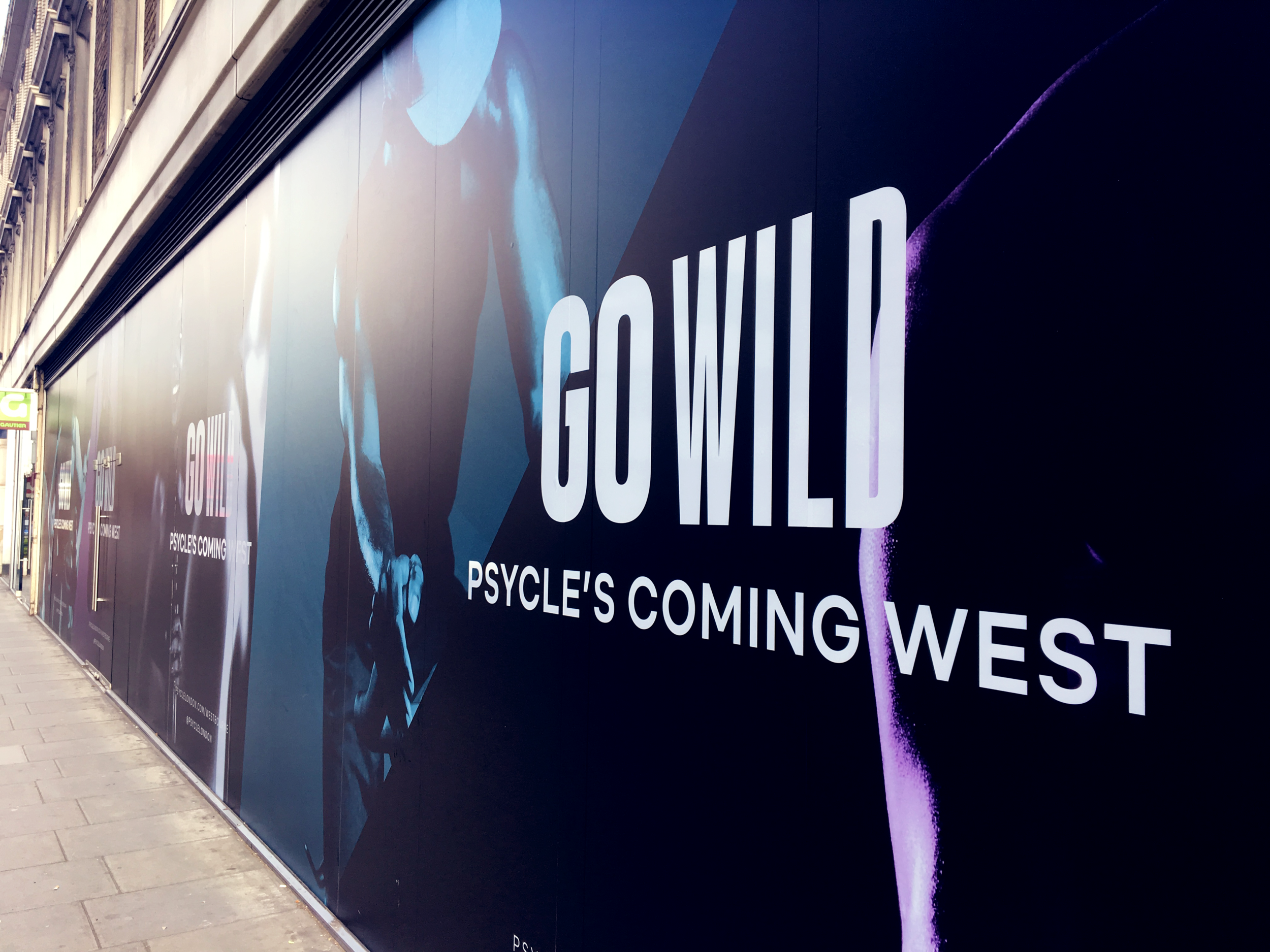 Promotional hoarding for Psycle's new studio in Notting Hill