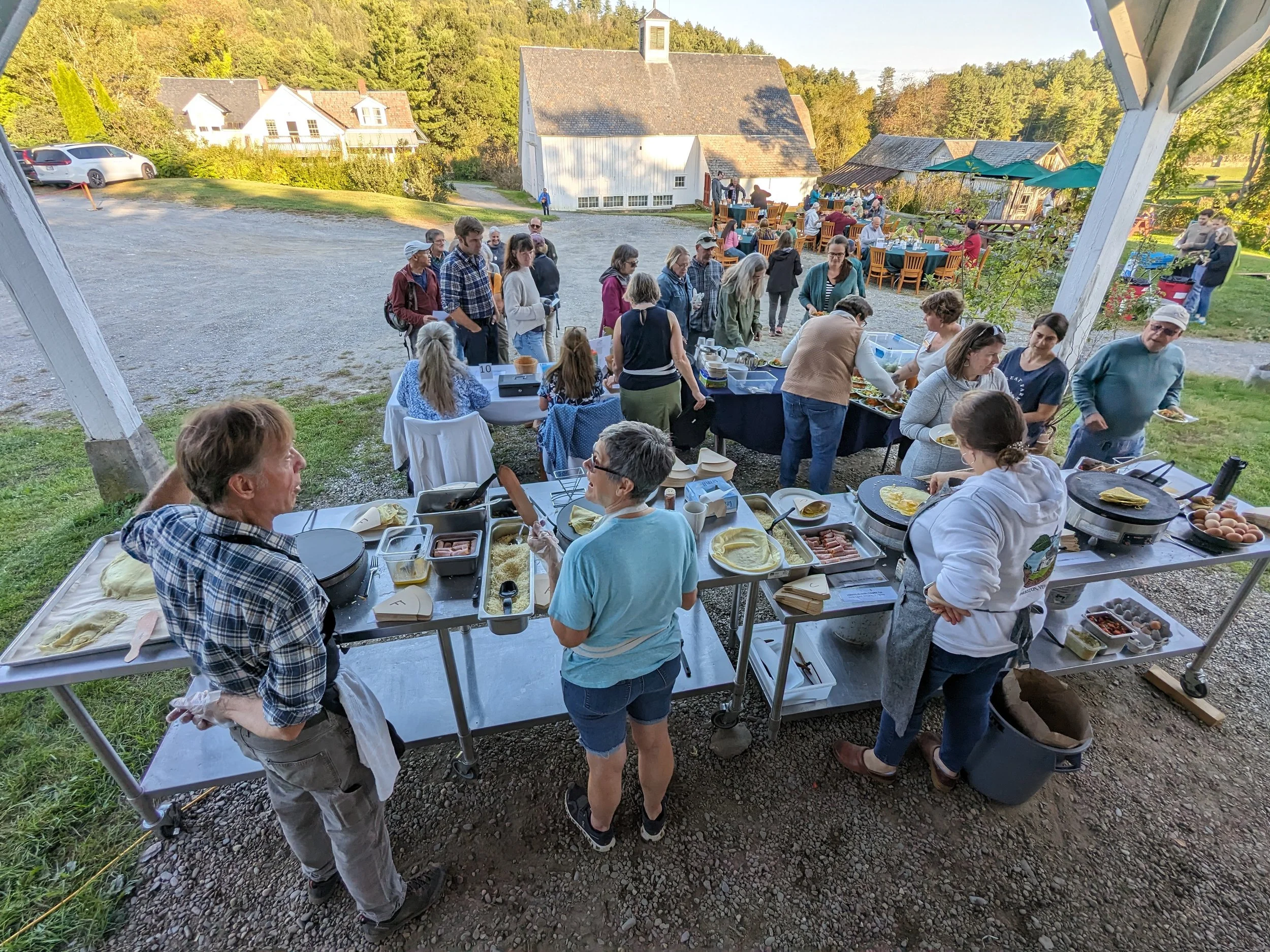 people lining up at farm to get crepes