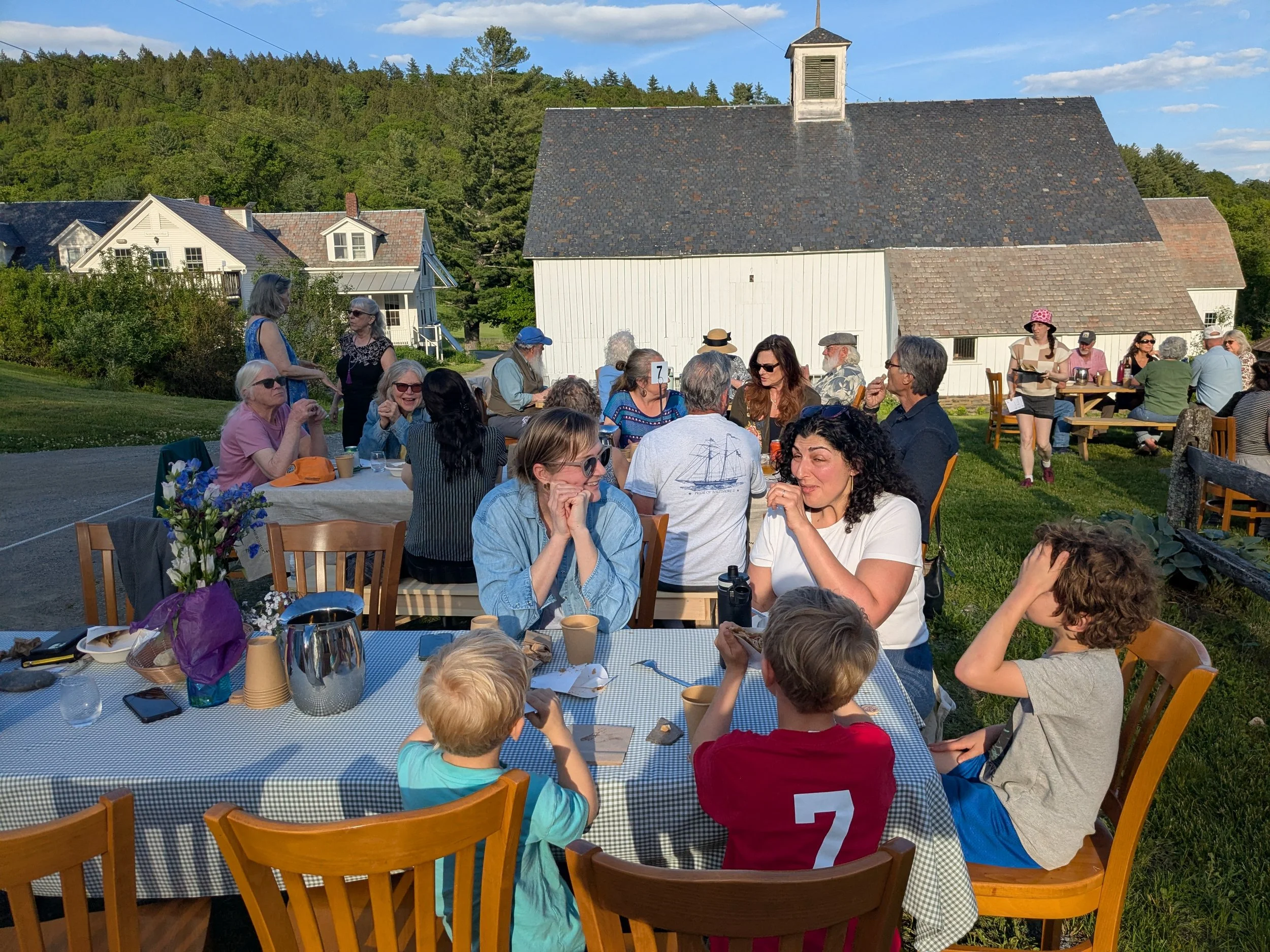 people at picnic tables eating crepes
