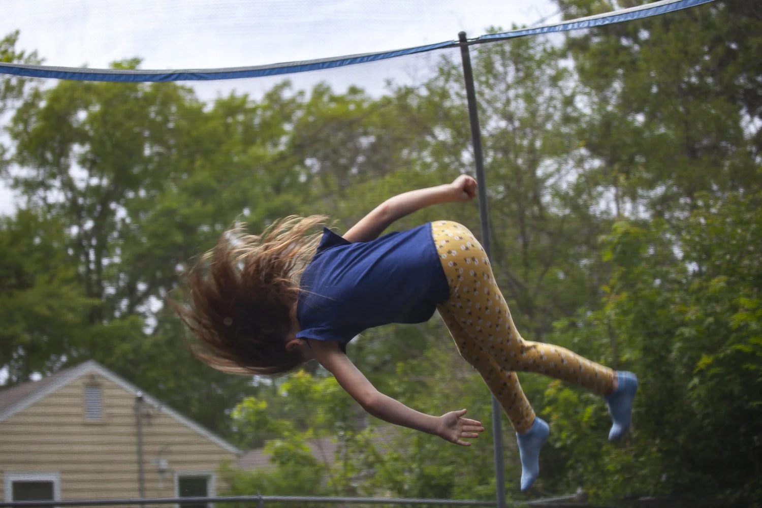 Two Sisters Spring into Summer on Their Trampoline