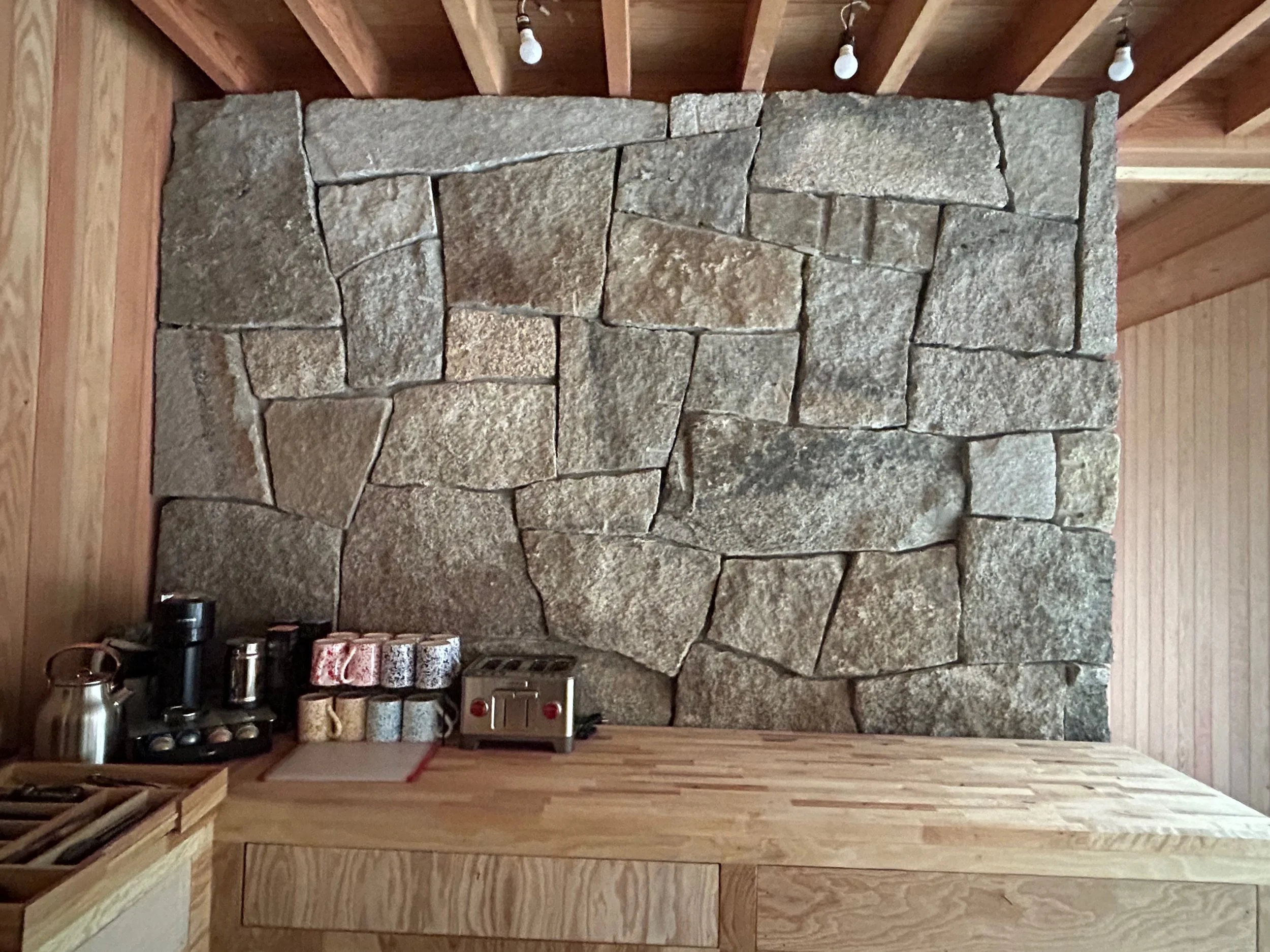 Granite veneer stone wrapped around hearth