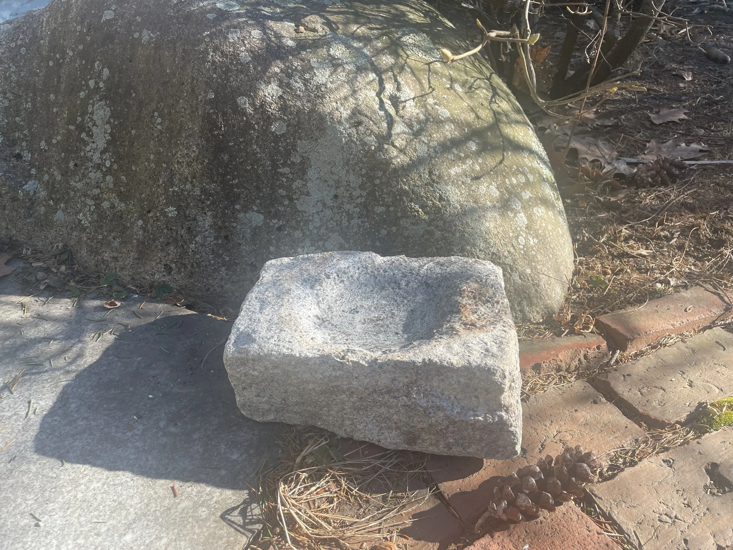 Bird bath made from rectangular piece of granite