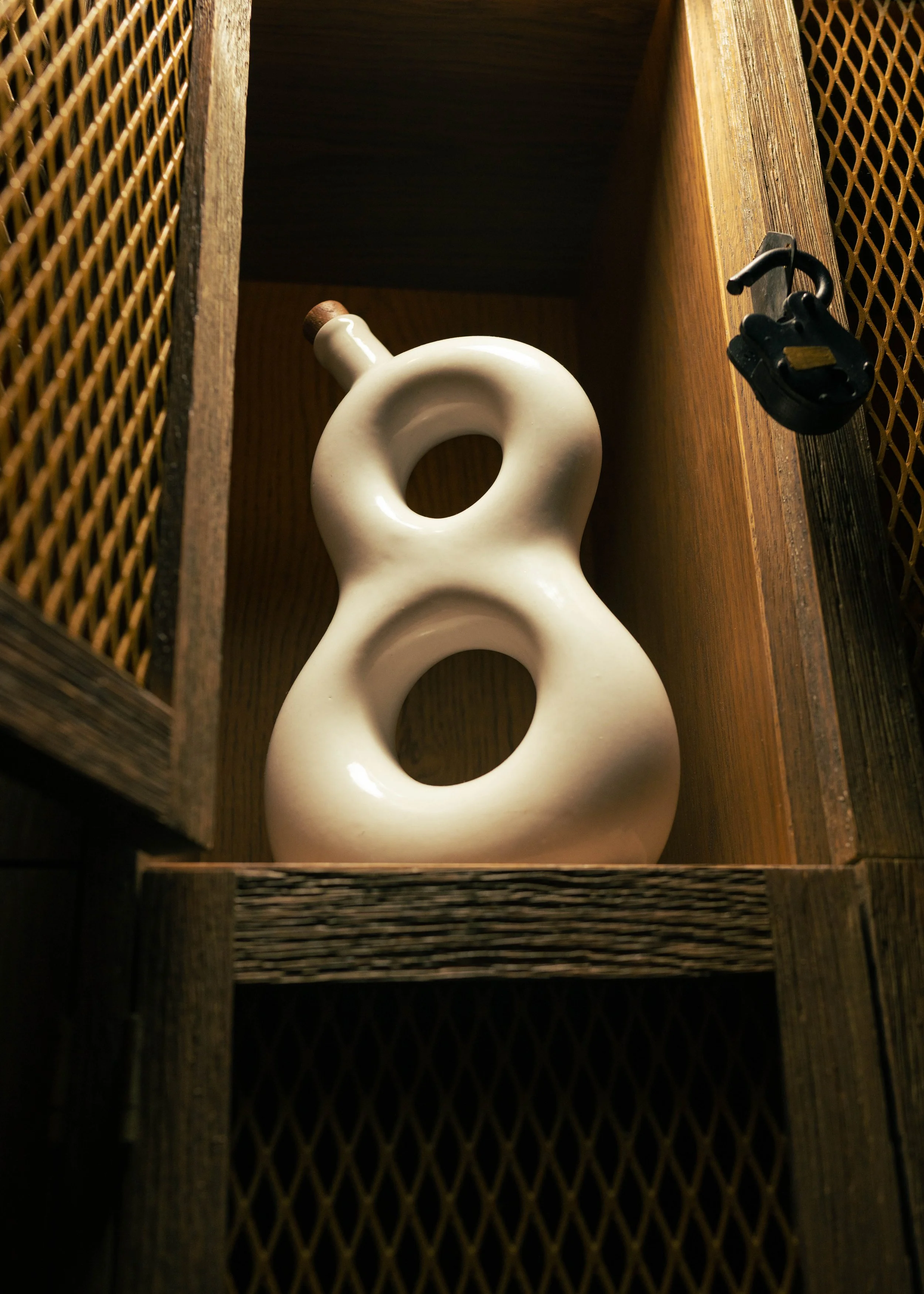 Elegant product photograph of 818 Extra Añejo Tequila bottle displayed at Bodega Taqueria y Tequila in Coconut Grove.