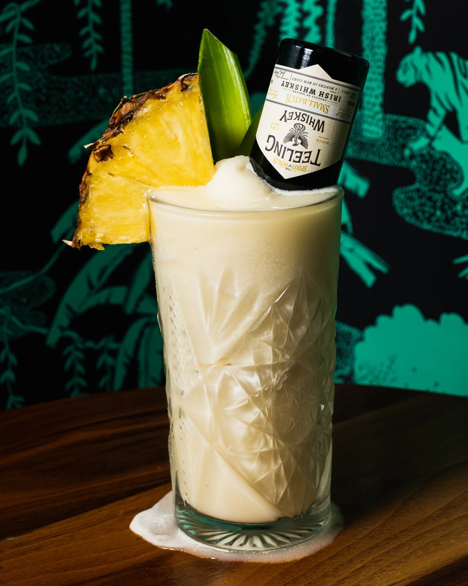 Creative cocktail photograph of a Teeling Whiskey Frozen Piña Colada garnished with pineapple, shot for Minibar on South Beach.