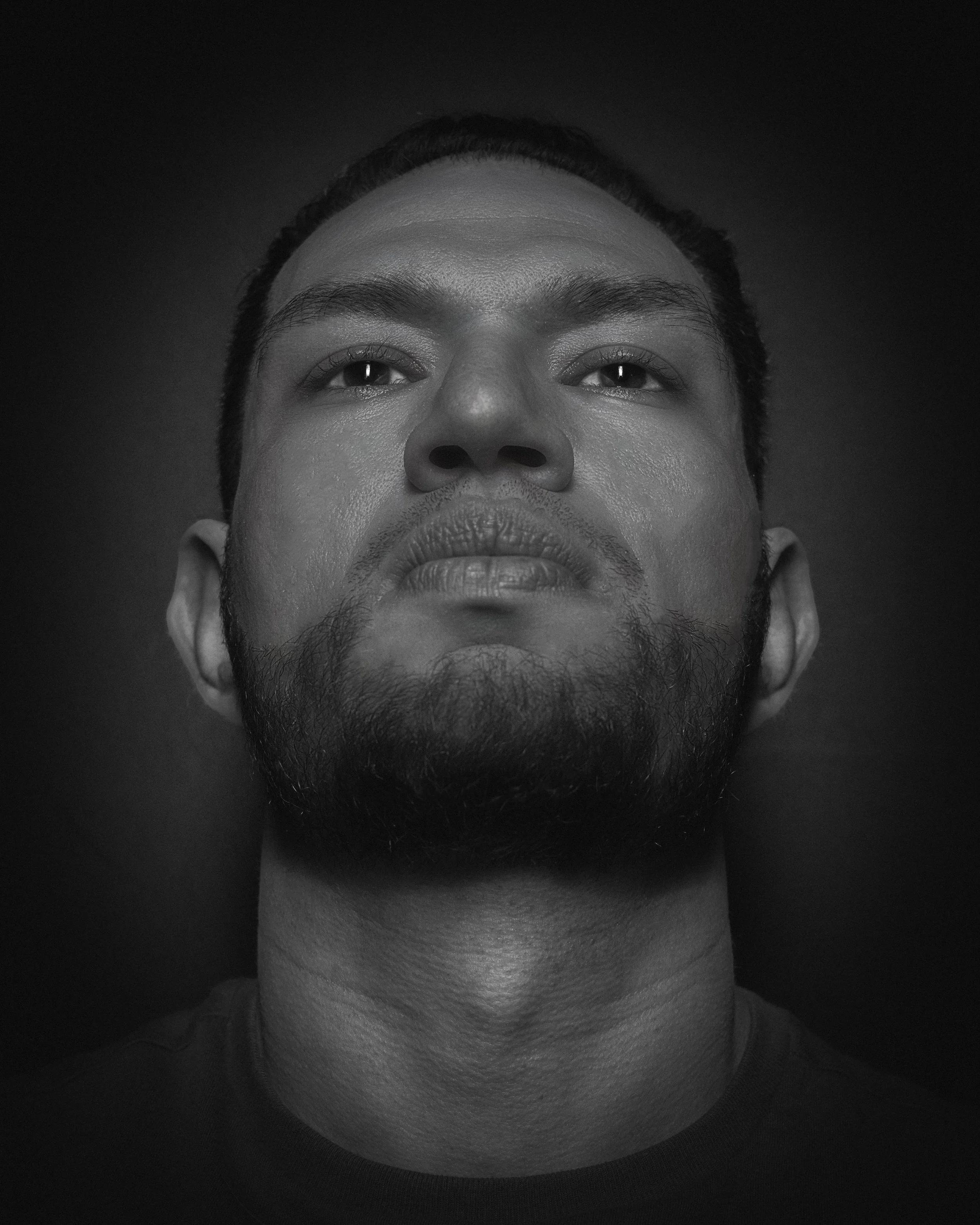 Black-and-white close-up portrait of Sebastian Gutierrez, photographed for portfolio work.
