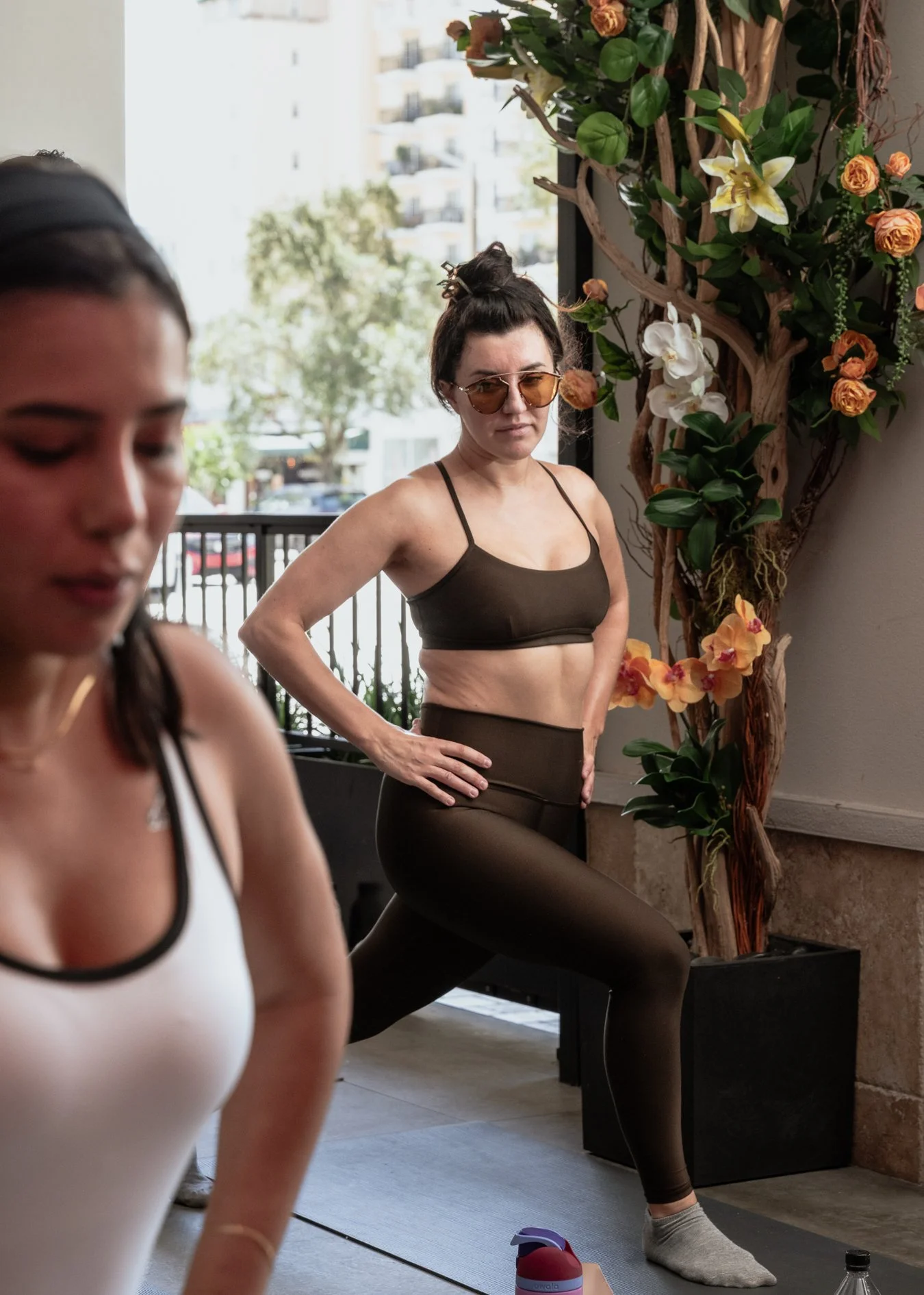 Participant stretching during the 'Pisco Made Me Do It' Pilates and brunch event with Sofia Rodriguez in Coral Gables, presented in collaboration with Pisco y Nazca.