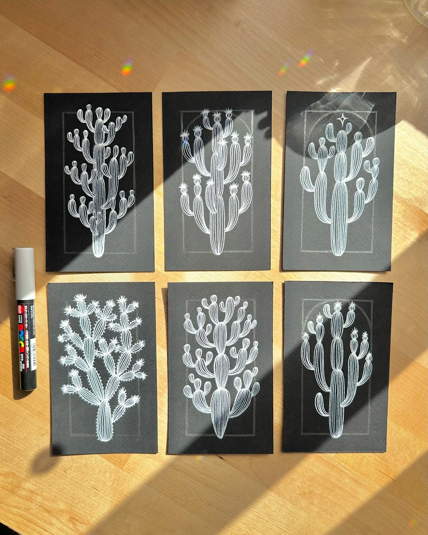 Happy Friday! Recently finished my collection of cactus illustrations using black paper and white pens #poscamarkers #stonehengeaquablack