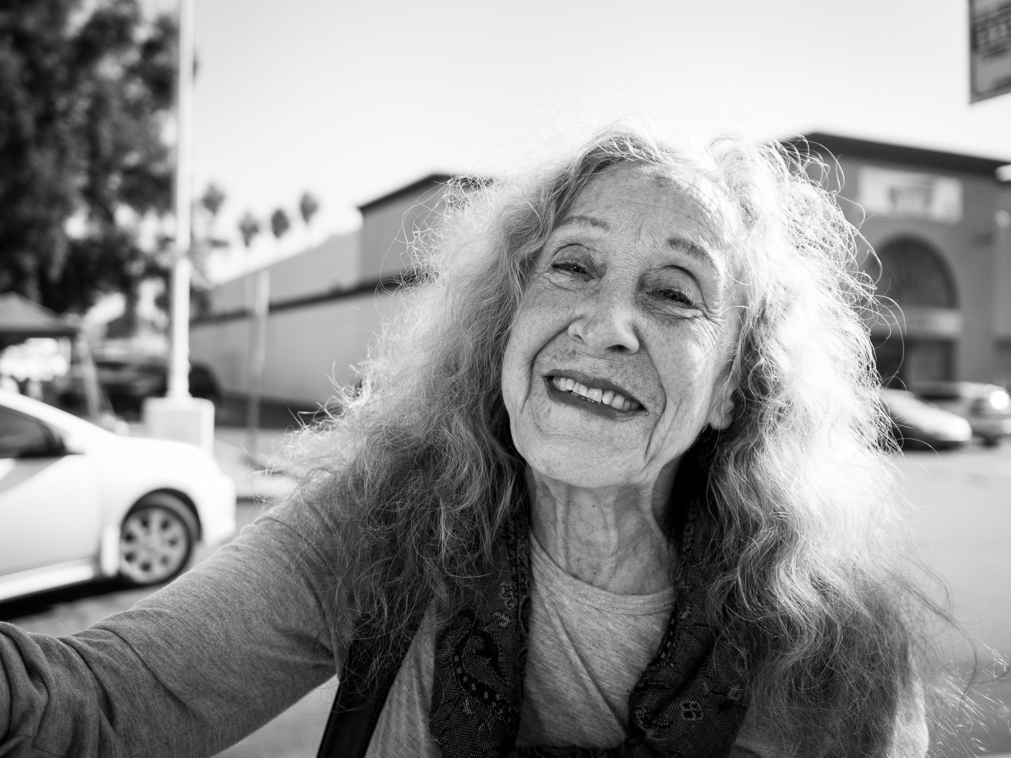 I drove past Marva while doing some shopping.   She was beautiful, and I thought about asking her for a portrait.

On my way out, I noticed that she was holding a sign that simply said "Please." I pulled over and asked her what was going on. She expl