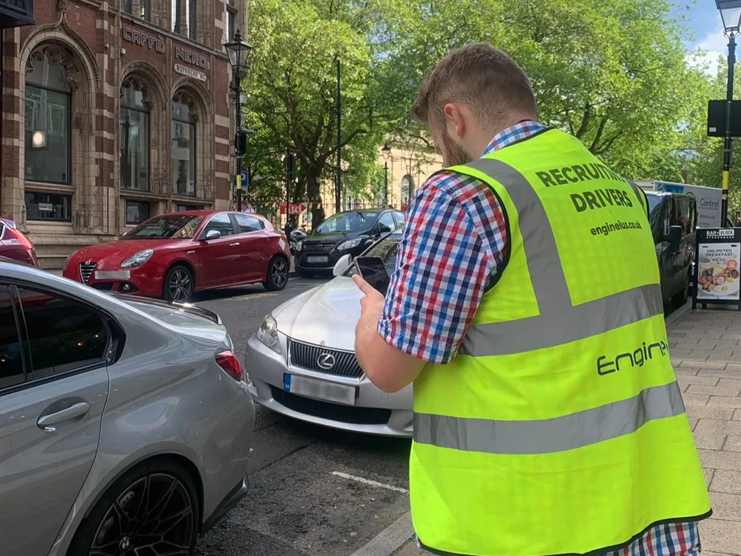 Engineius driver recording vehicle details during a collection
