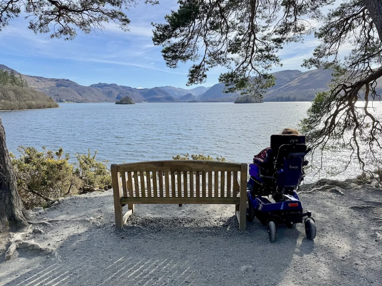 A wheelchair user at Friars Crag, Derwentwater, The Lake District