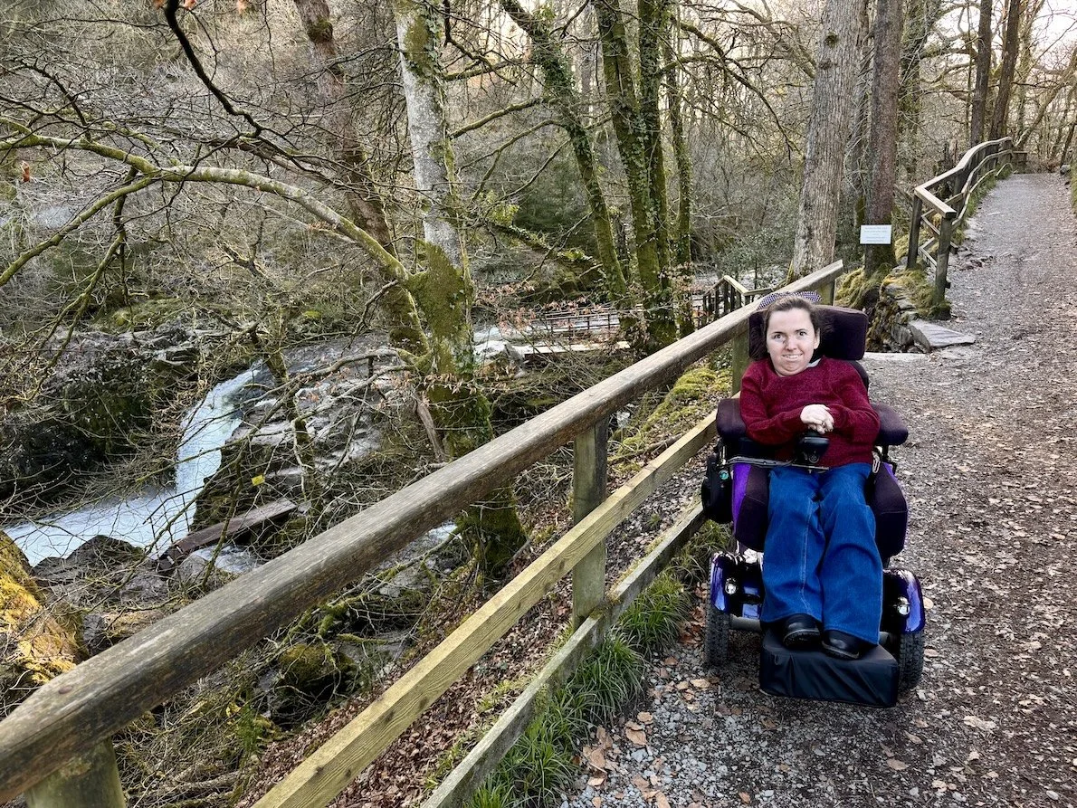 Wheelchair user at Skelwith Force, a wheelchair accessible waterfall in the Lake District