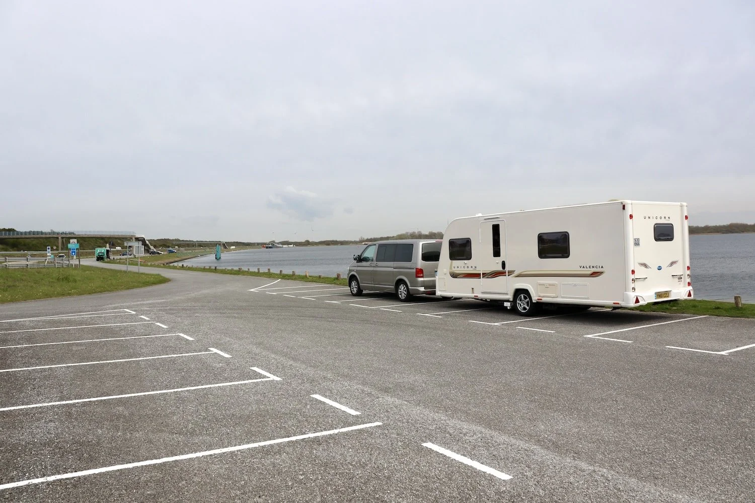  A VW Transporter towing a Bailey Unicorn Valencia touring caravan  
