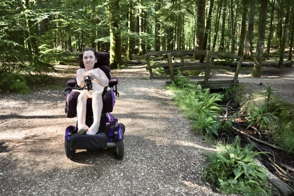  Karla in her powerchair on the Tall Trees Trail wheelchair accessible walk in the New Forest 