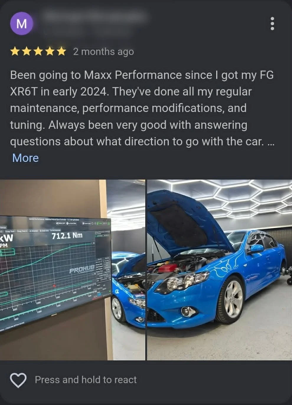 A blue Subaru car with its hood open in a dealership or service center, next to a digital dashboard displaying engine tuning data.