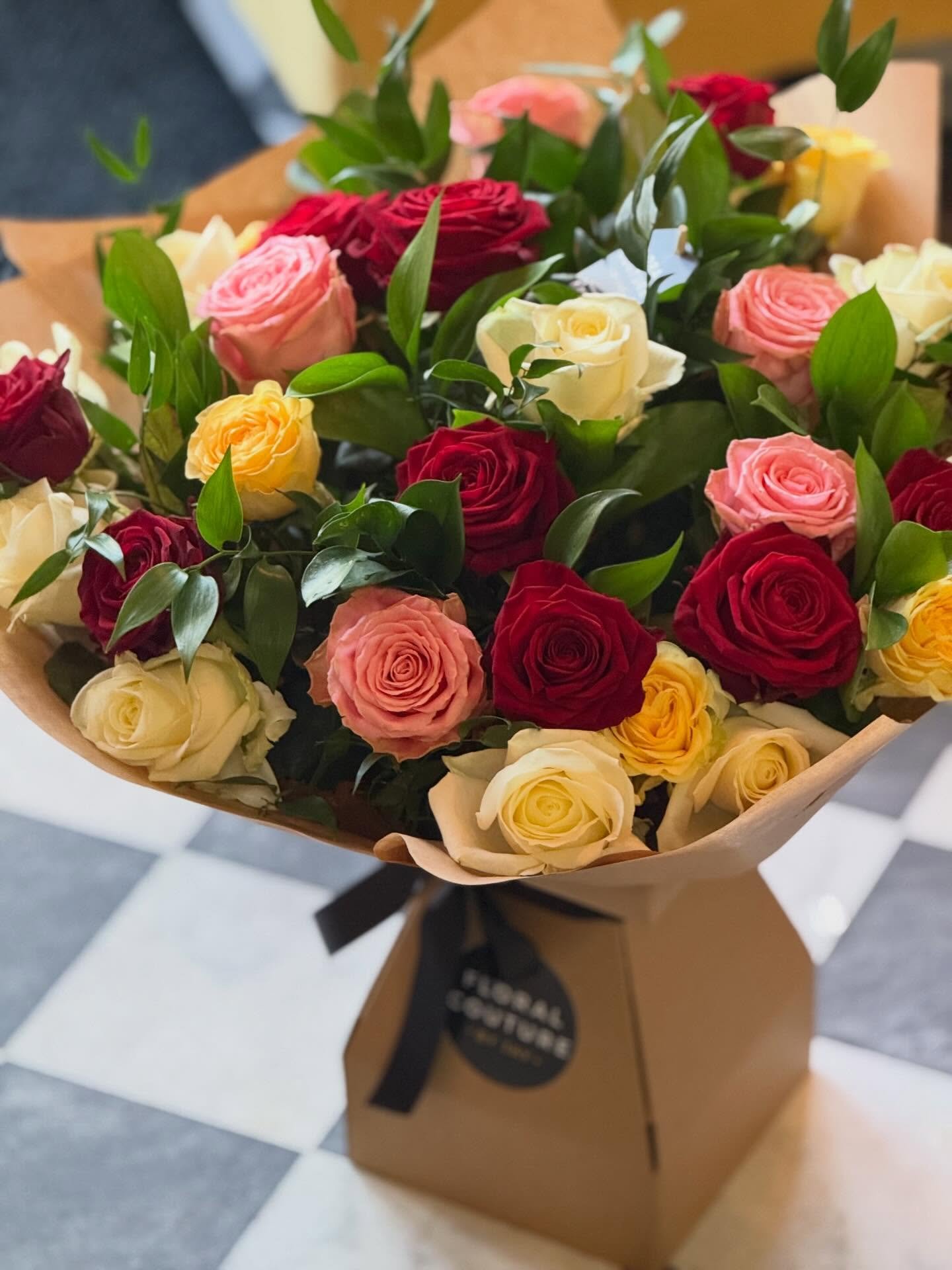 A bouquet that speaks the language of love, elegance, and joy 🌹✨

This stunning arrangement brings together the timeless beauty of red, white, pink, and buttercup roses &mdash; each color telling its own story. ❤️ Passion. 🤍 Purity. 💗 Grace. 💛 Wa
