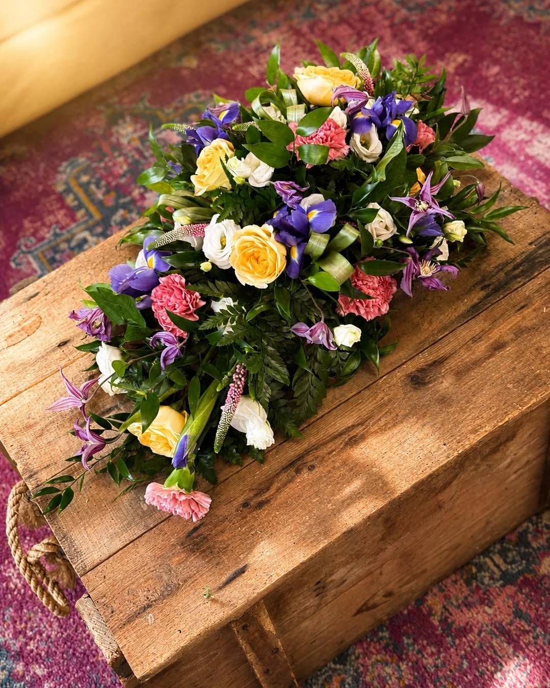 🤍 Crafted with love, care, and compassion. 🌿

This elegant single-ended spray has been thoughtfully designed to offer a beautiful tribute and a heartfelt farewell. Featuring soft buttercup roses, delicate white lisianthus, vibrant irises, pink carn