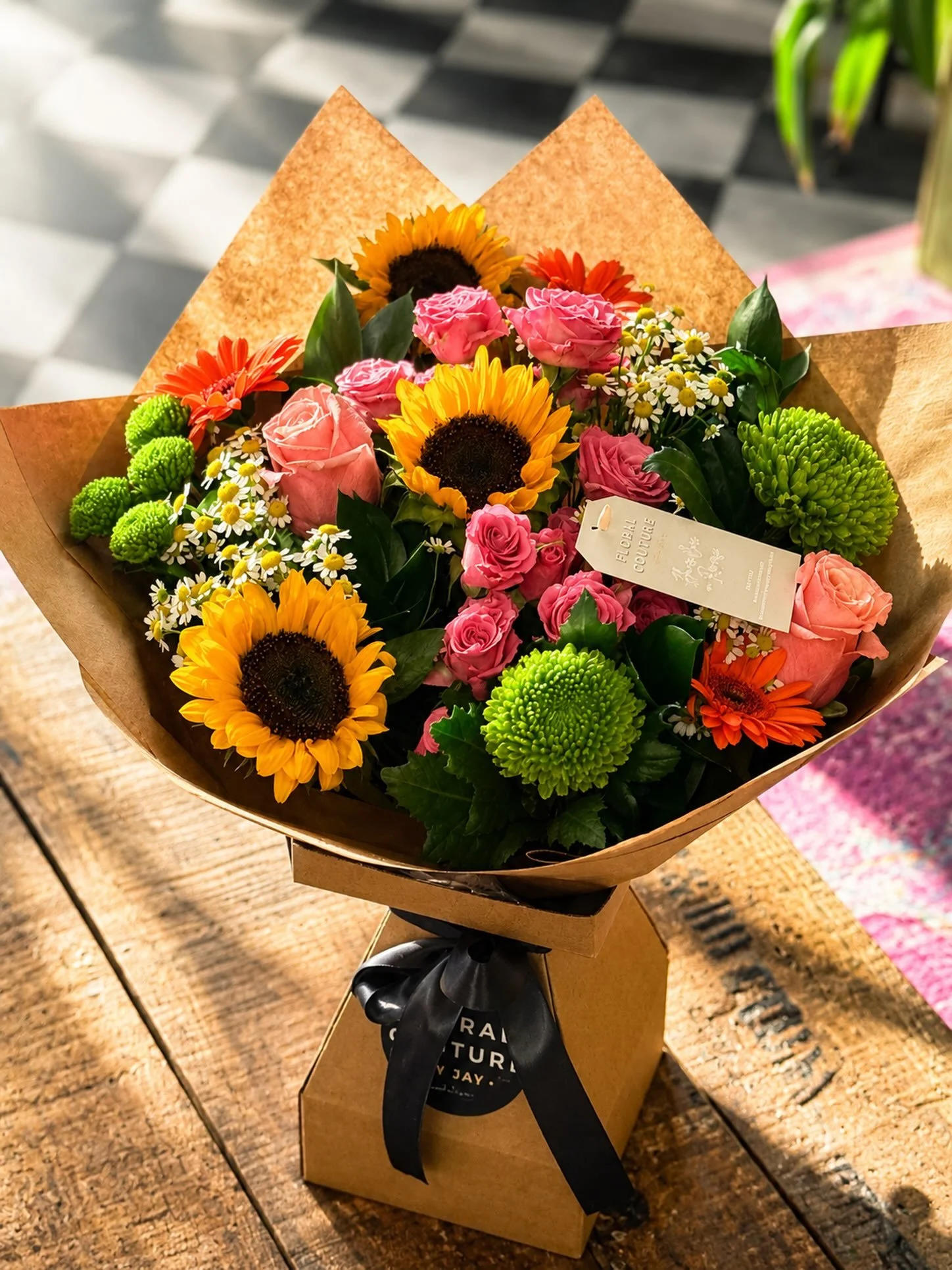 🌻✨ A little sunshine, a touch of romance, and blooms that speak from the heart. 💕🌸

This vibrant handcrafted bouquet brings together radiant sunflowers, elegant roses, cheerful gerberas and lush green chrysanthemums&mdash;designed to brighten some